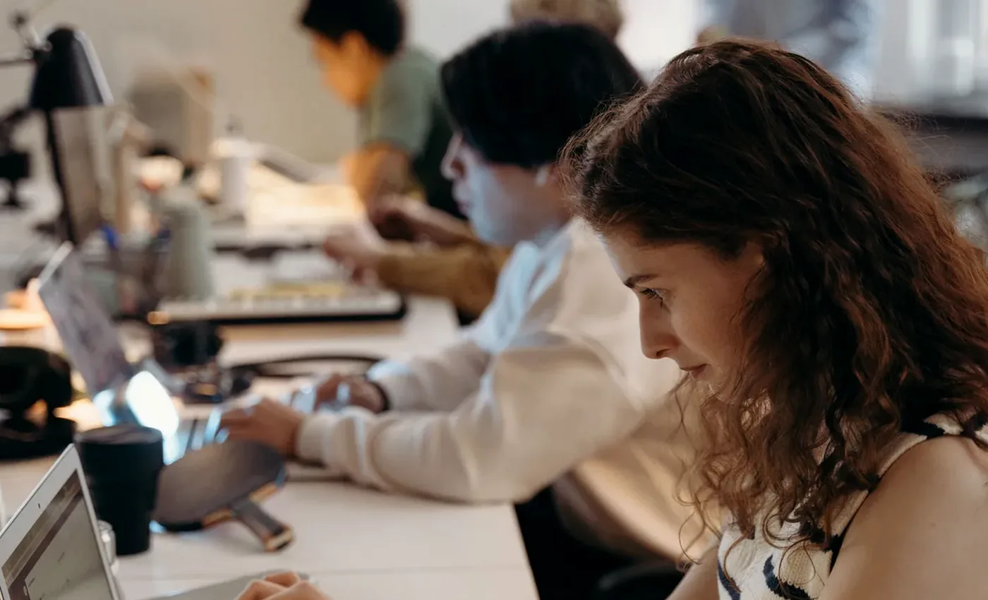 Remote web portal developers reviewing user flows and system architecture