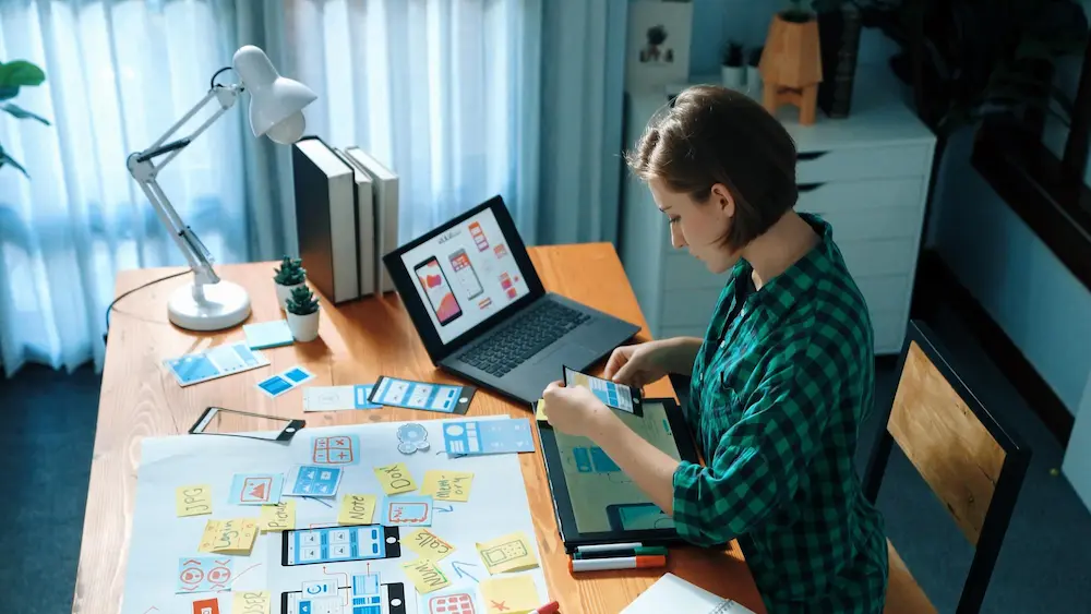 Creative professionals collaborating on digital design work in a bright office
