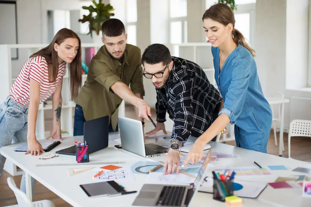 A creative team discussing design requirements and brand work