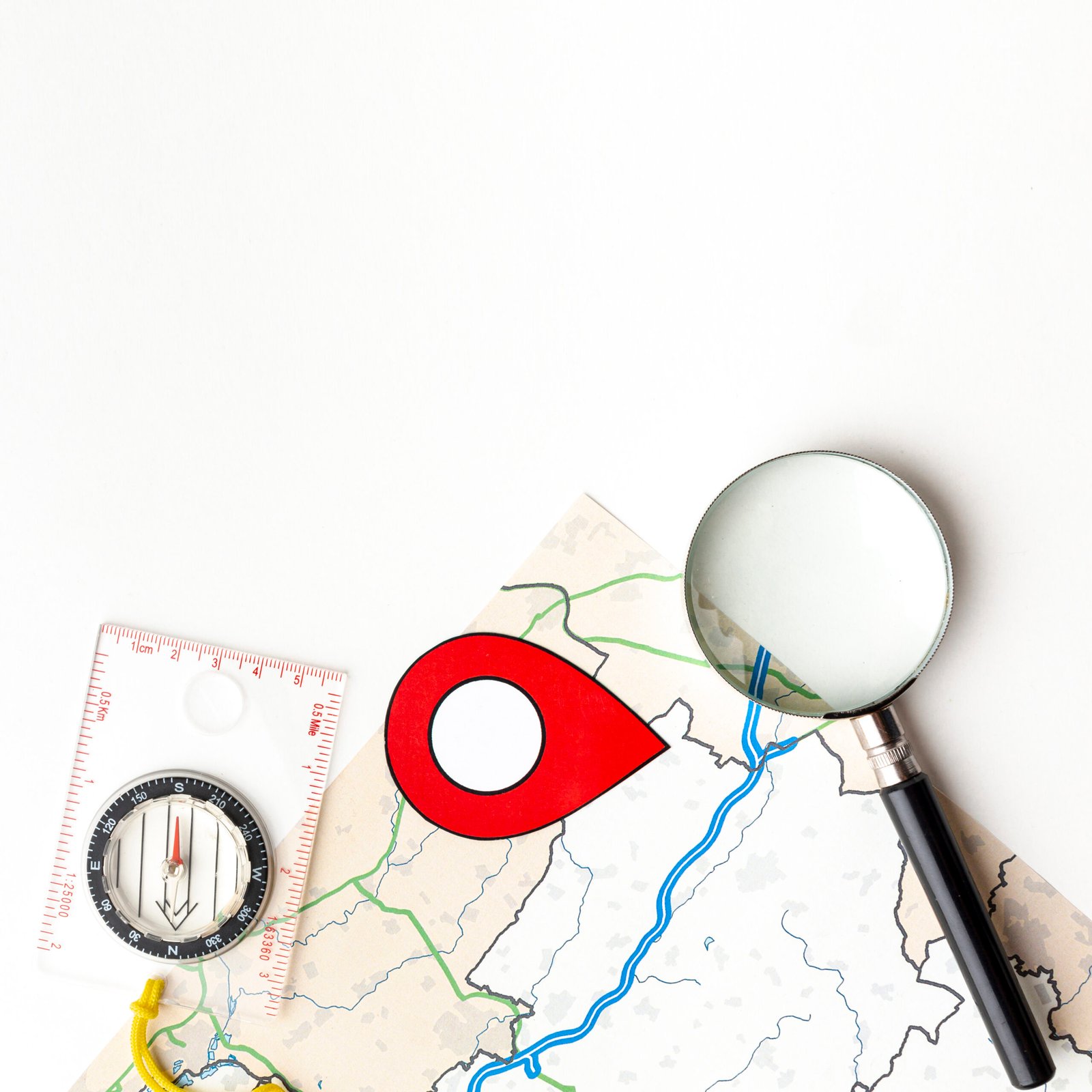 Map with a location marker and magnifying glass representing local search visibility and geographic targeting